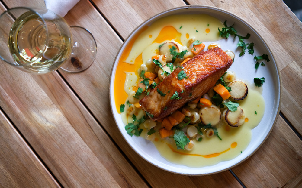 Salmon Norma, made with Heart of palm, corn, sweet potato, and lime butter sauce.