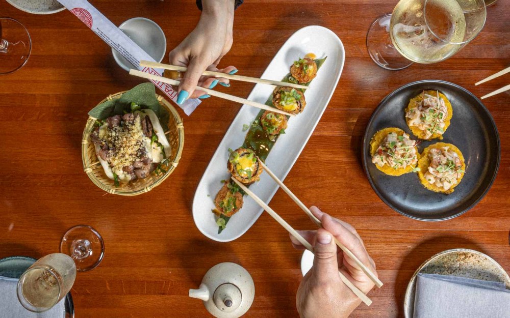 Fusion of Asian and Latin flavors served in a vibrant setting, featuring creative sushi, unique dishes, and an unforgettable dining experience.
