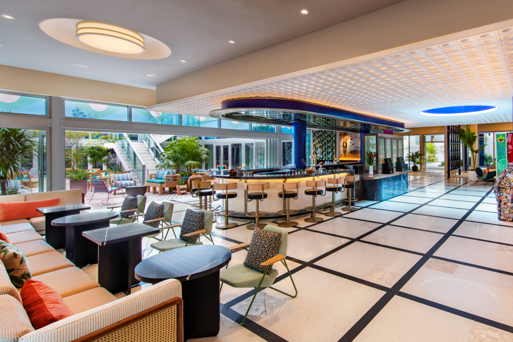 Bar Moxy is a focal point of the lobby with a retro-inspired style that also serves as the reception area.