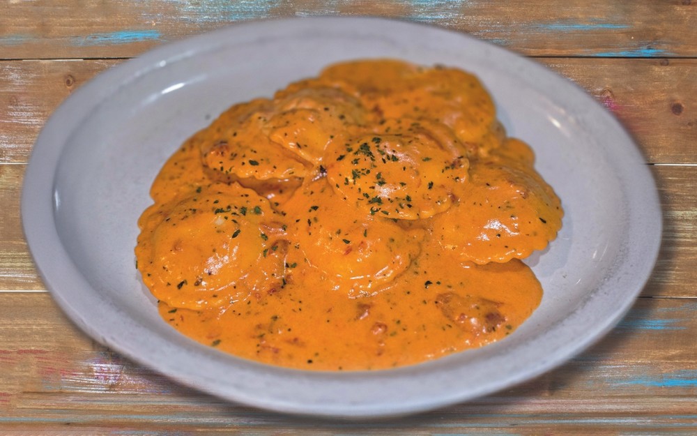 Lobster ravioli, served with a creamy pink sauce and parmesan.