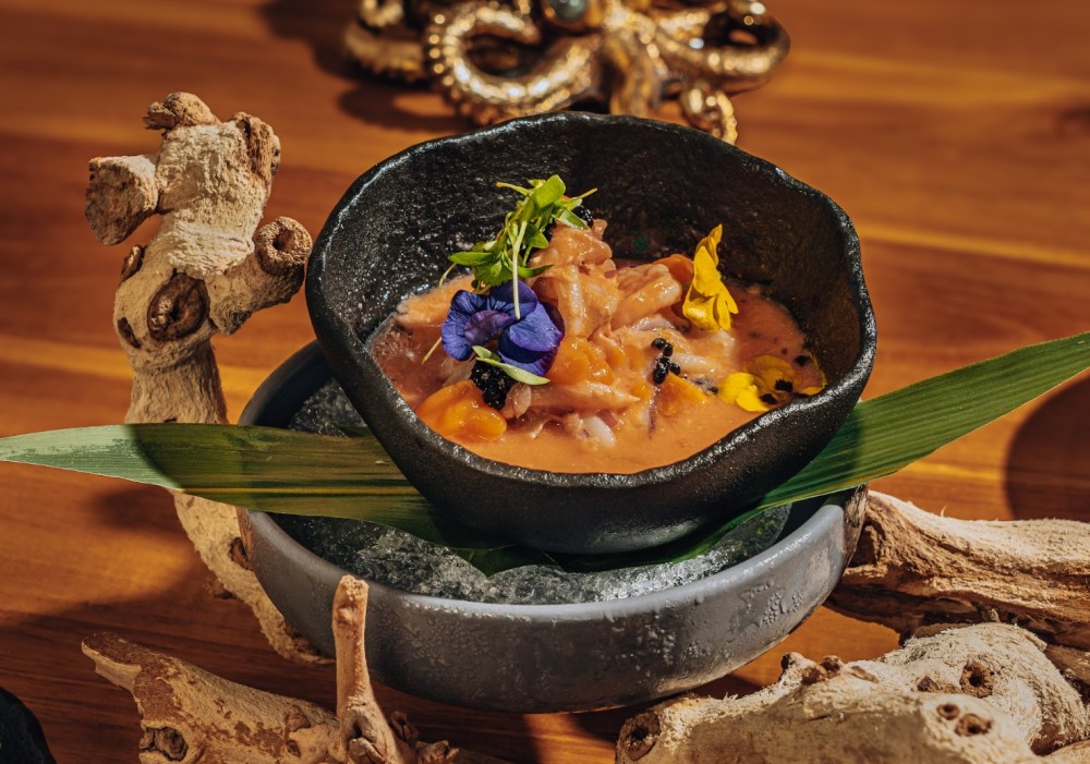 Fresh fish, seafood, smoked rocoto leche de tigre, red onion, cilantro, sweet potato purée, truffle oil