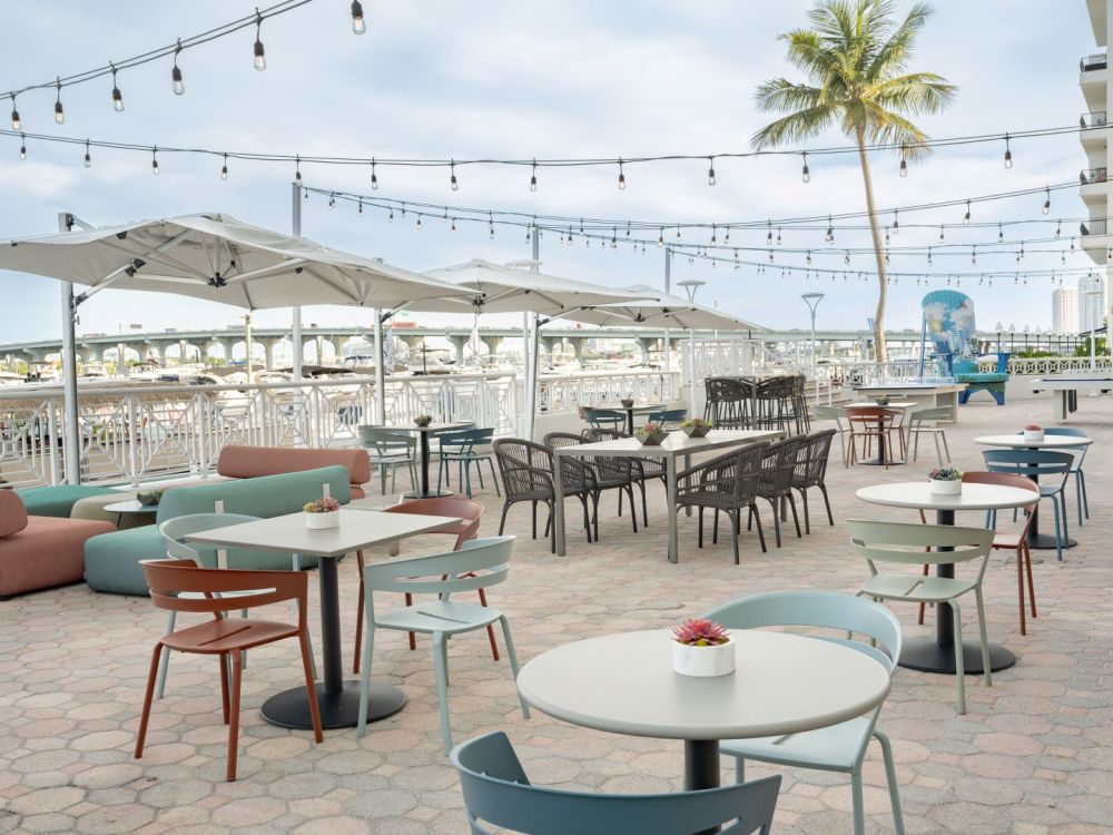 Relax and refuel on our breezy Gold Coast Patio, where fresh air and waterfront views set the stage for a perfect break.