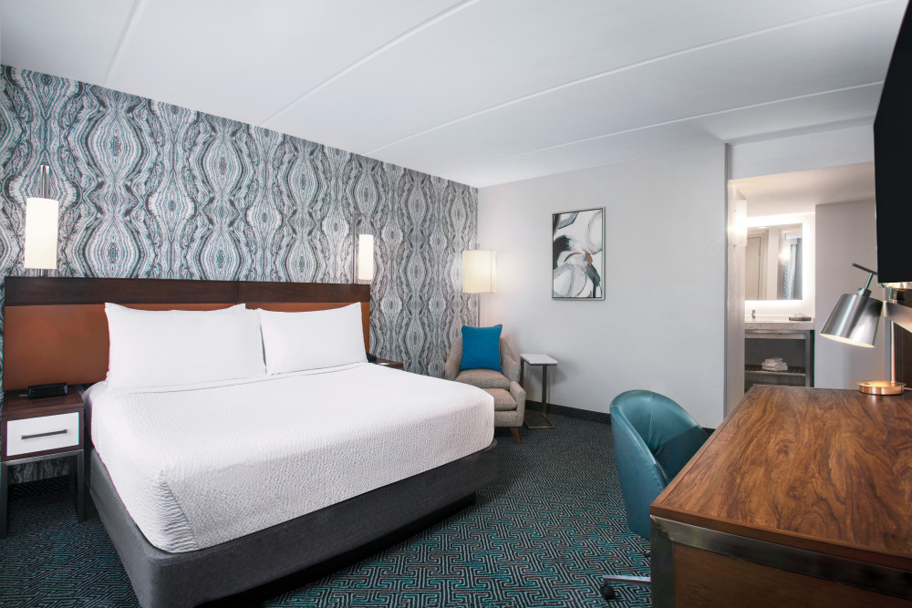 A room to recharge. Our King Suites feature a private bedroom with king size bed and a separate living room area with sofa bed, dining table and wet bar.