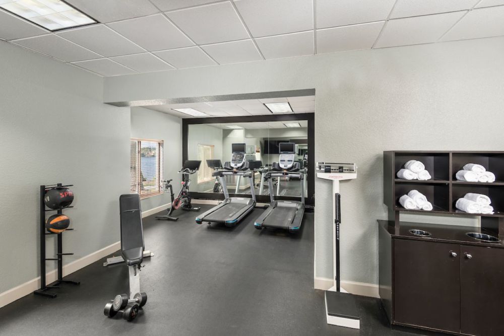 Fitness Center featuring peloton machine