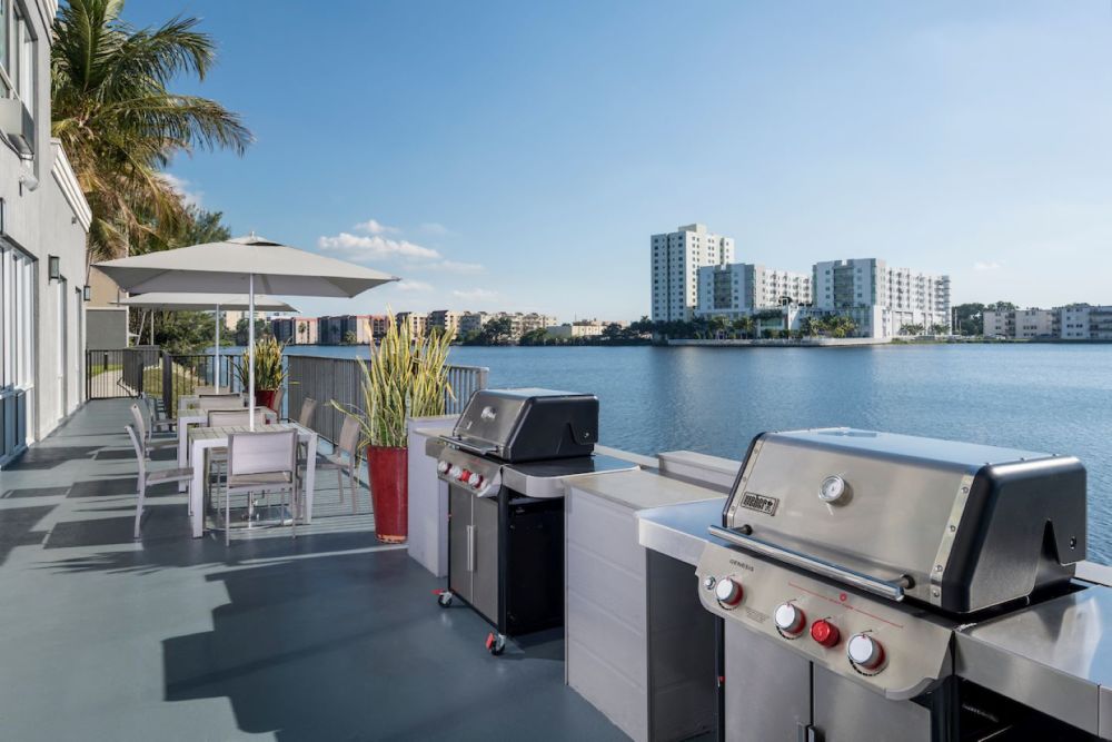 Outdoor patio featuring 2 BBQ grills and overlooking Blue Lagoon
