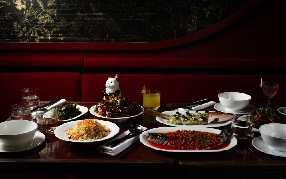 A table with hits from our menu such as the Hunnan Chili Sea Bass, Supreme Fried Rice, Hidden Crispy Chicken, Golden Panda and more.