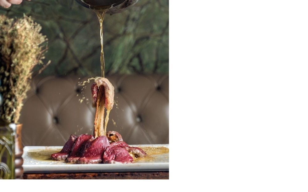 Perfectly seasoned steak, prepared tableside and served sizzling in creamy butter