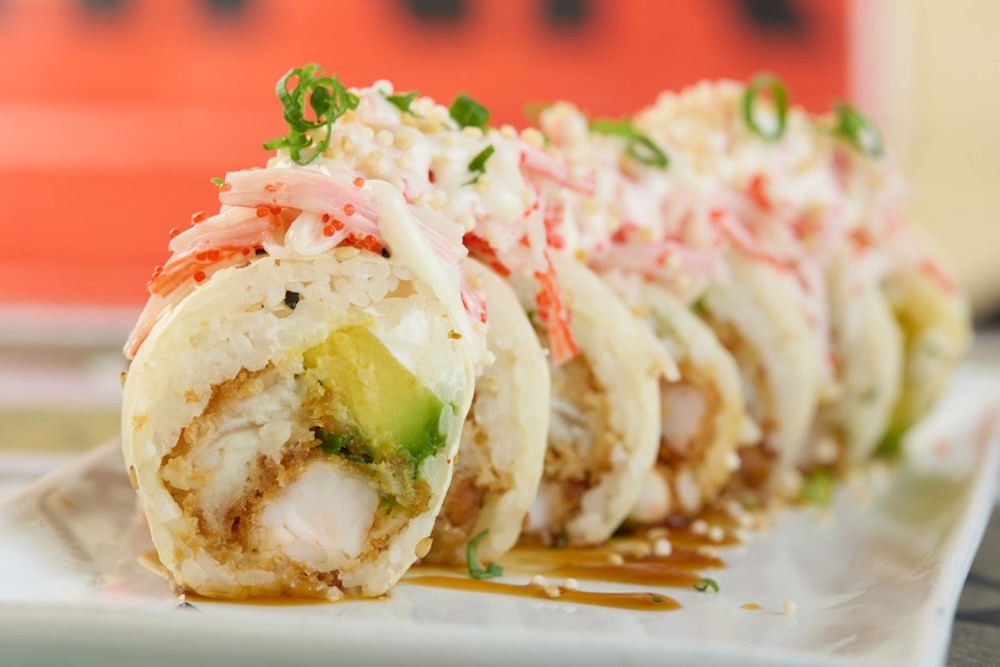 Mamenori, fresh salmon, tuna, avocado, cream cheese, scallions, sweet plantain, crispy shrimp, truffle oil, sriracha, red masago, crispy quinoa.