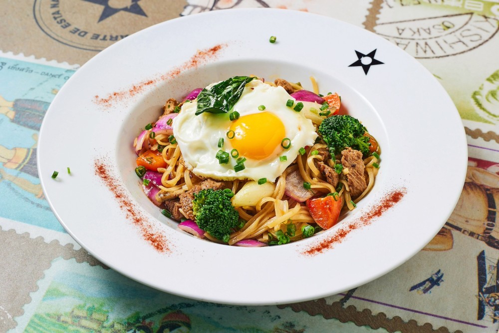 Beef, Thai rice noodles, sautéed vegetables, toasted basil, oyster sauce, hint of spice.