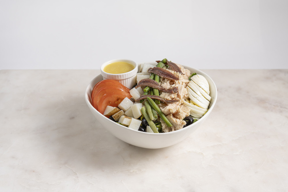 Romaine, Tomatoes, Potatoes, Boiled Eggs, Haricot Verts, Anchovies, Black Olives, Tuna & French dressing