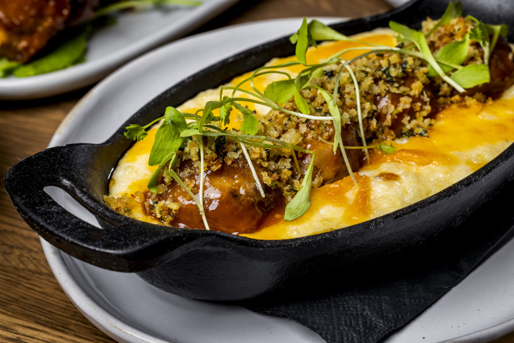 roasted meatballs, herb crust, Guinness glaze, grits, Irish cheddar