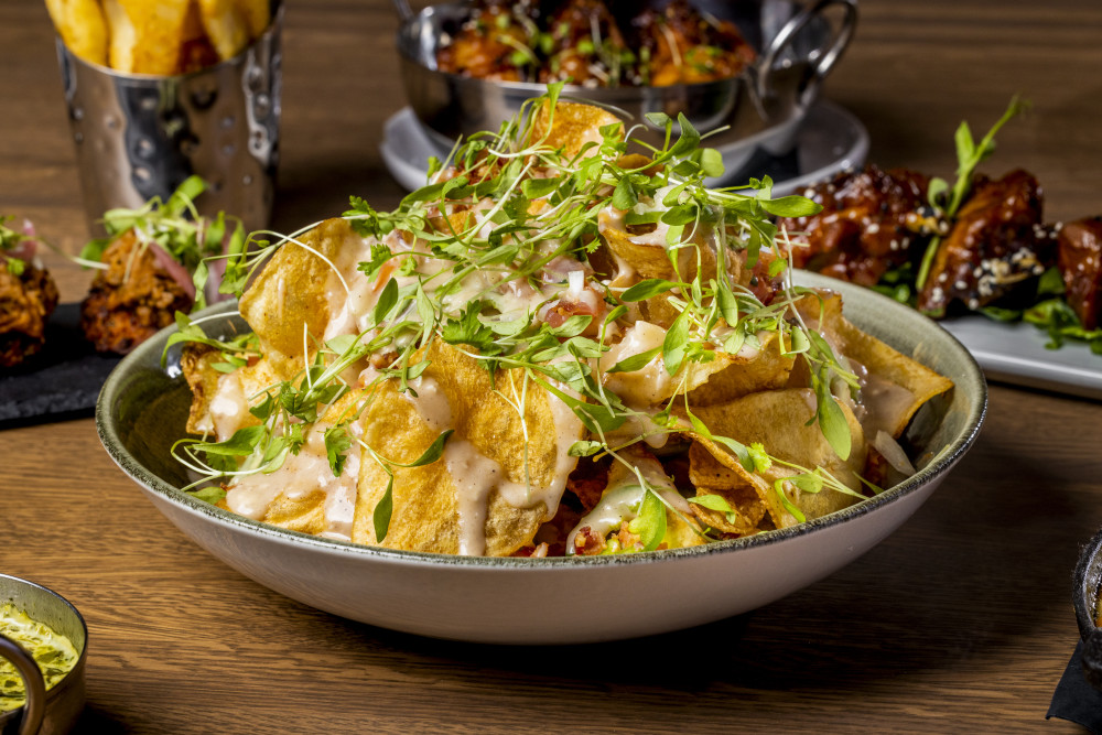 fried potato, diced tomato, jalapeño, bacon, onions, Guinness beer brie fondue,