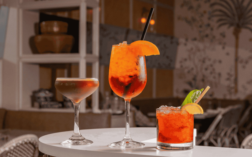 Kick off happy hour with a creamy cocktail, citrusy spritz, or minty refresher—three bold sips made for golden hour in Miami.