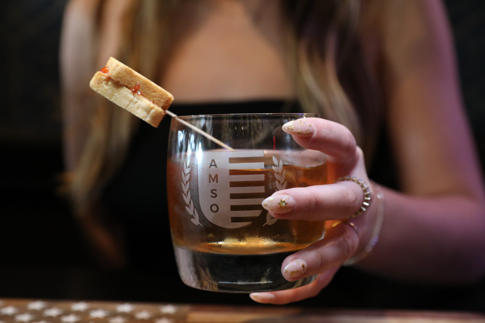 Screwball Whiskey, Makers Mark, Strawberry Preservers, Black Walnut Bitters, Topped with Mini PB&J Sandwich.