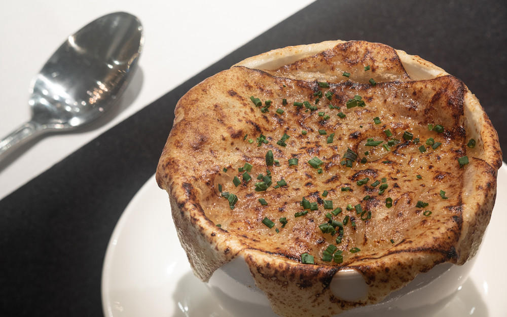 French Onion Soup served with homemade croutons and melted Swiss cheese