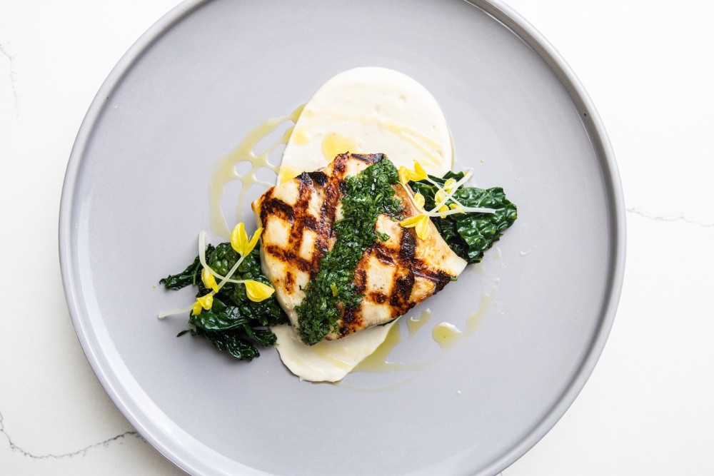 Steelhead trout, pil pil sauce, wilted greens, crispy new potato