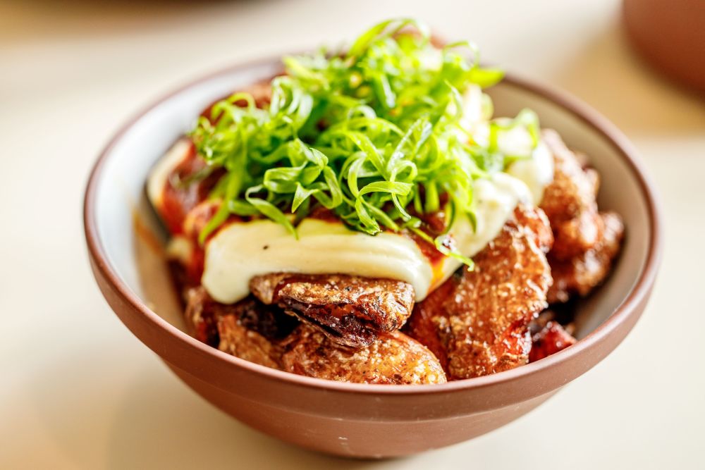 twice cooked fingerlings, garlic aioli, brava sauce