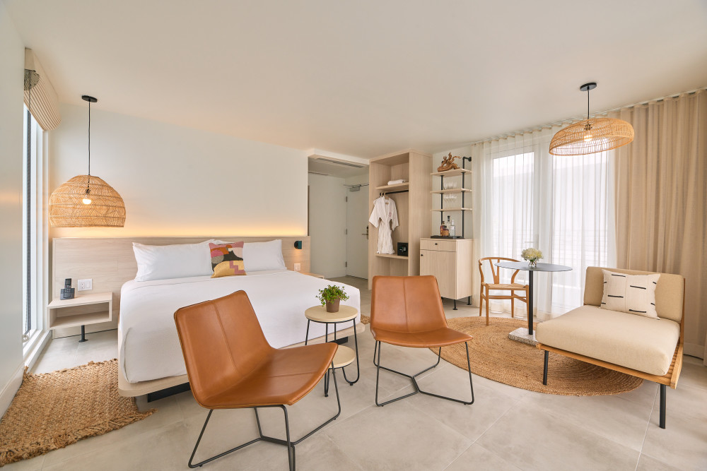 The penthouse has a king bed and is 910 sq. ft. including the outdoor terrace and jacuzzi.