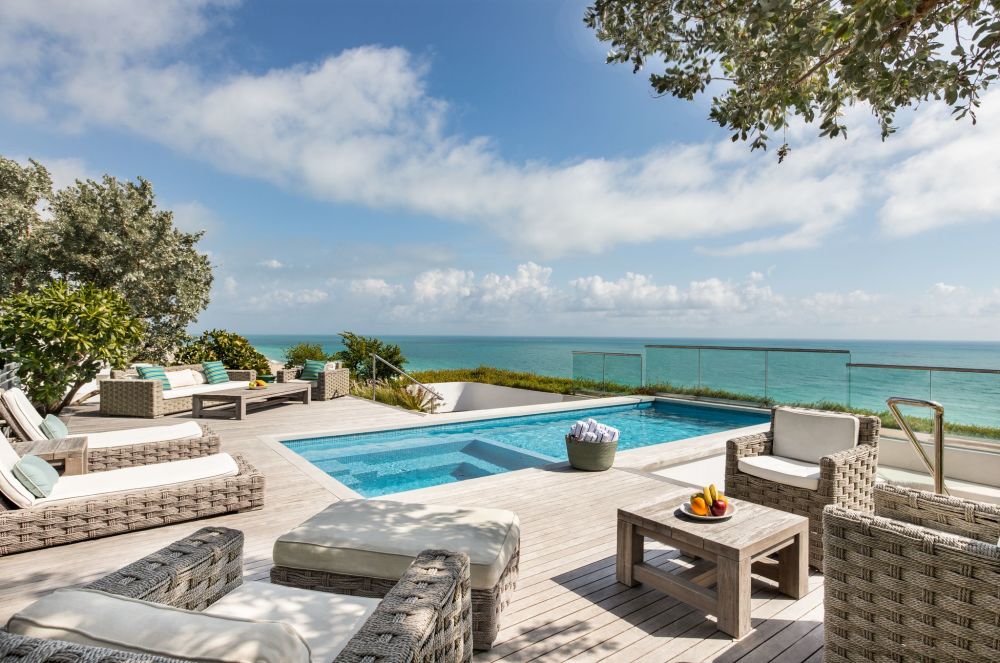 Penthouse with panoramic ocean front views, rooftop terrace with a private pool.