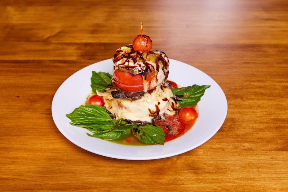 Portobello mushroom, roasted eggplant, vine ripened tomato, melted Fontina cheese, drizzled with an aged balsamic vinegar, olive oil,& pomodoro sauce
