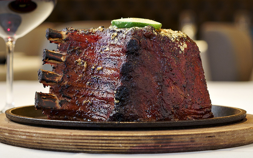 Perry's Famous Pork Chop Cured, roasted, slow-smoked and caramelized, served with homemade applesauce