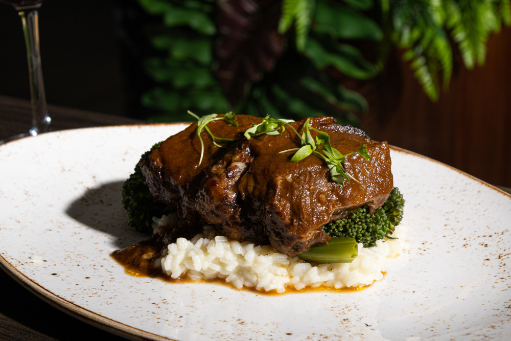Slowly braised for 48 hours on top of a parmesan risotto bed and broccolini.