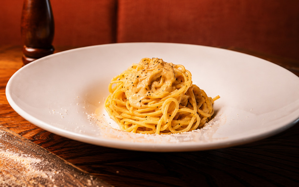 Spaghetti with crispy pancetta, creamy egg sauce, and Pecorino Romano.