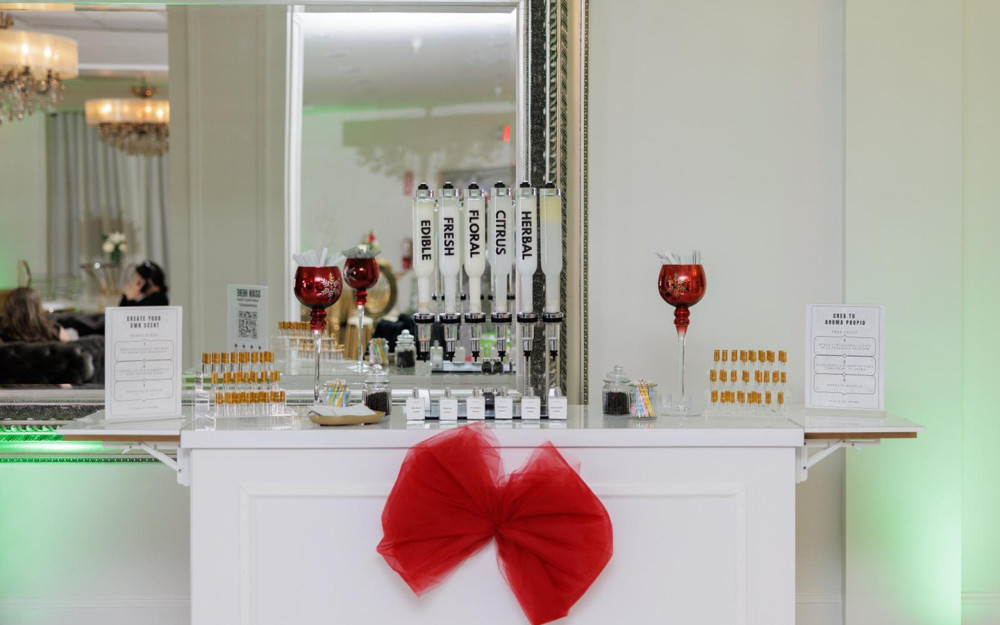 Chic and elegant fragrance station with red and gold details.