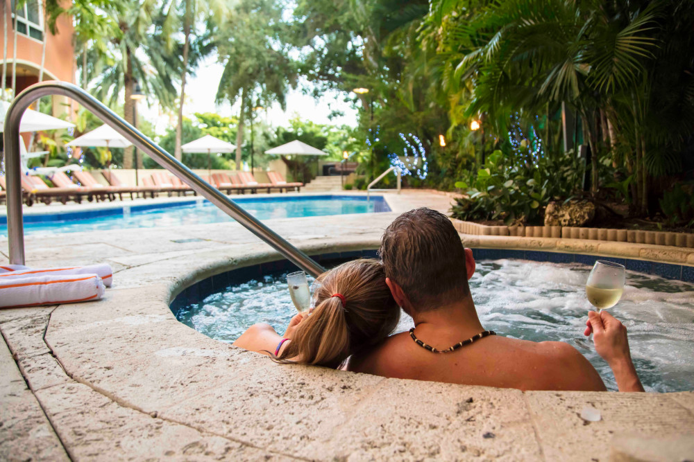 The Mutiny Hotel’s exclusive lush, very private, tropical pool terrace and courtyard is our crowing gem.   Relax tired muscles in the secluded Jacuzzi, swim in the heated pool, nap on a chaise-lounge; repeat.   Enjoy trade-wind breezes with the scent of wild orchids and coconut.  Listen to the chatter of parrots and peacocks – Coconut Grove’s “Official” mascots.  Or, listen to the sound of cascading water as it splashes over a coral stone waterfall and into a serene coy pond.   Our fish are very happy…