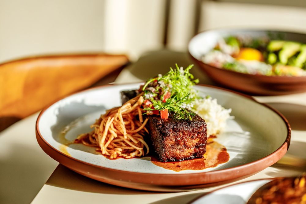 confit pork shoulder, fermented cabbage, chili dusted daikon radish, jus