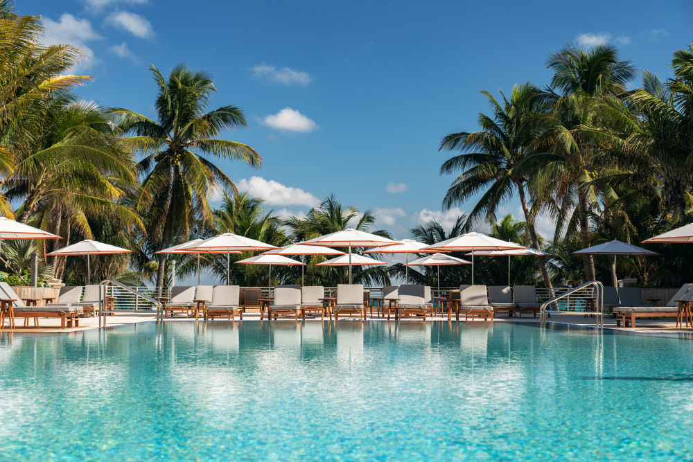 The elevated pool at The Ritz-Carlton, South Beach overlooks the Atlantic Ocean beyond.