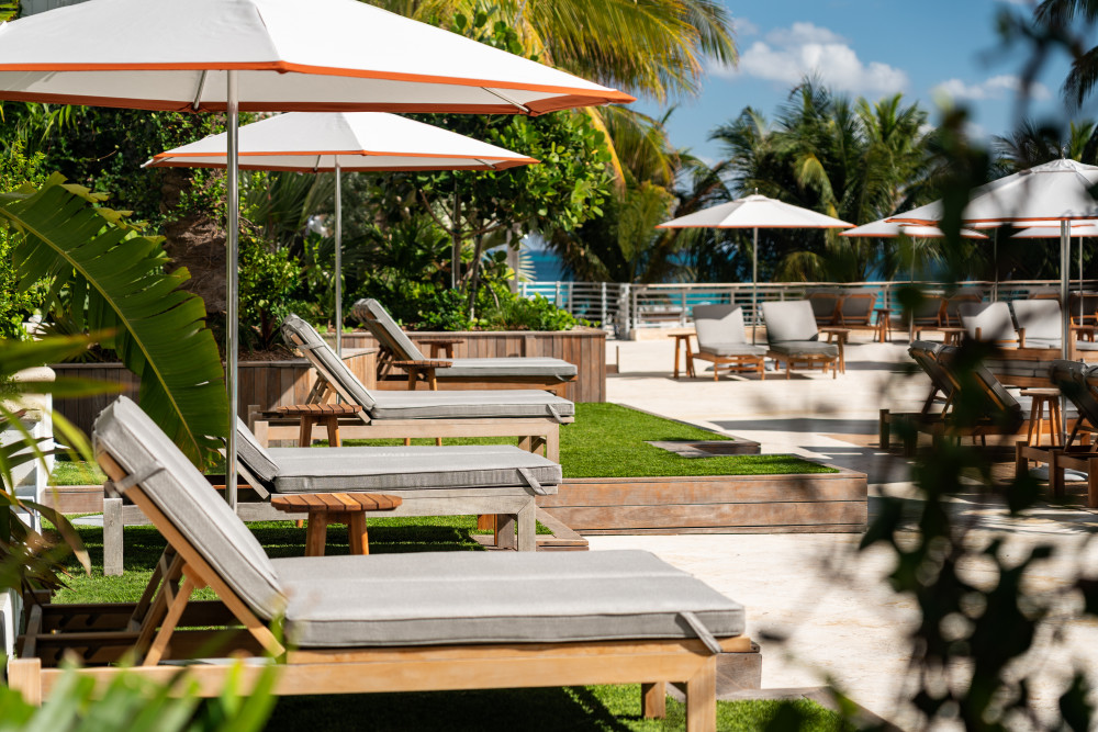 The elevated pool at The Ritz-Carlton, South Beach overlooks the Atlantic Ocean beyond.