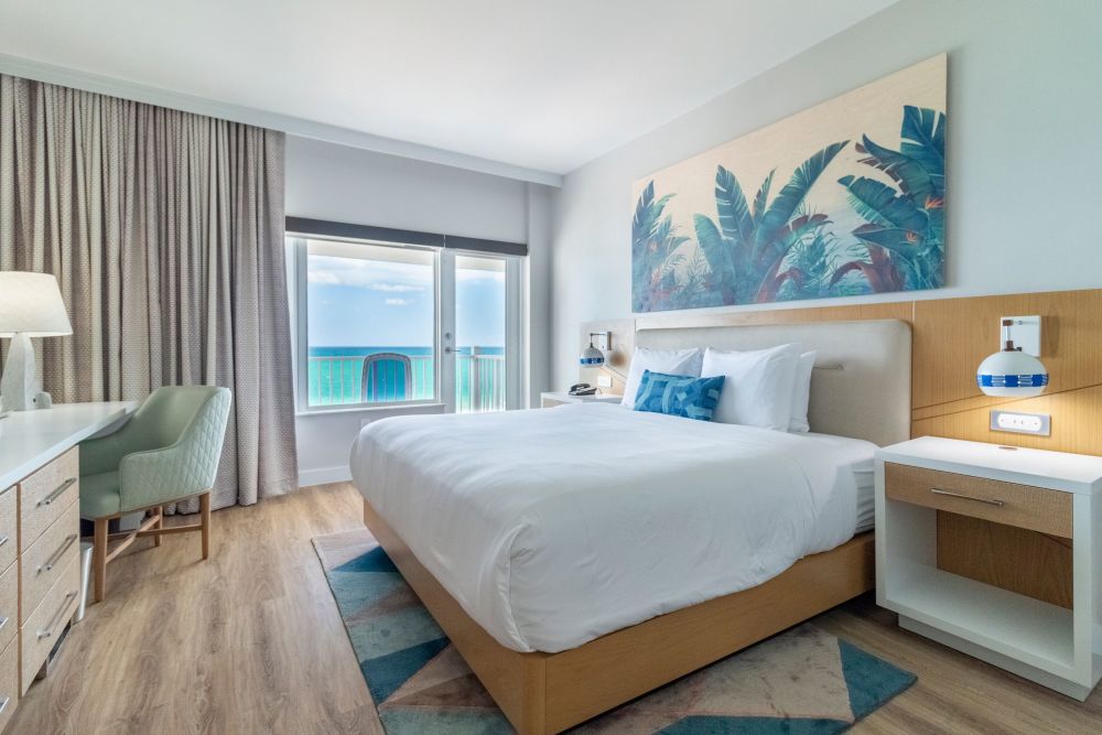 King bed room with ocean view and a balcony
