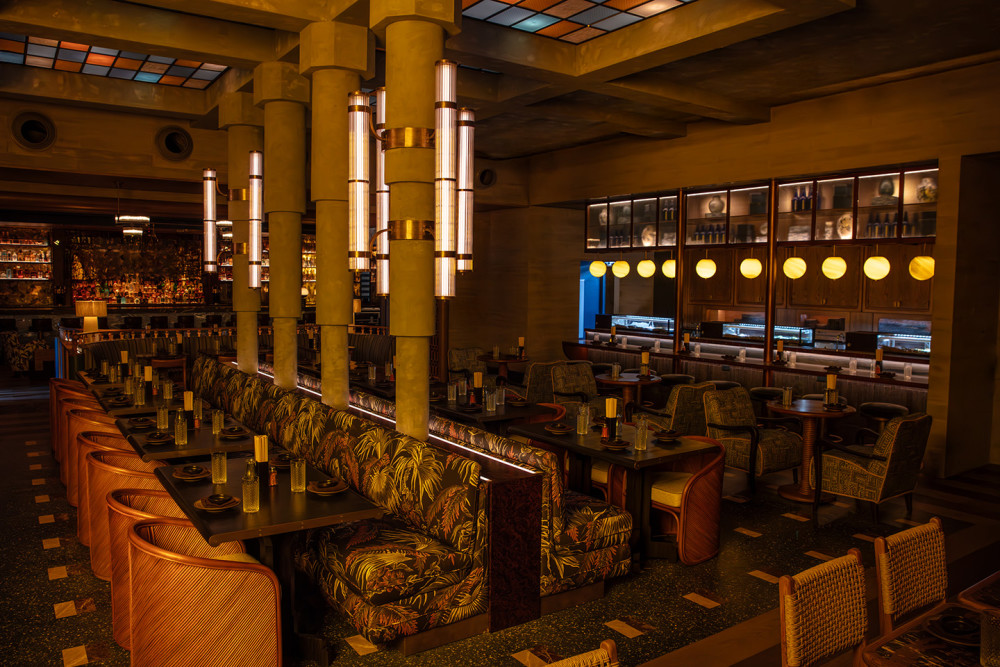 Interior of Double Knot Miami in Wynwood showcasing ambient lighting, Japanese sushi bar, robata grill & cozy cocktail lounge seating.