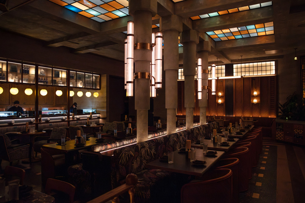 Interior of Double Knot Miami in Wynwood showcasing ambient lighting, Japanese sushi bar, robata grill & cozy cocktail lounge seating.