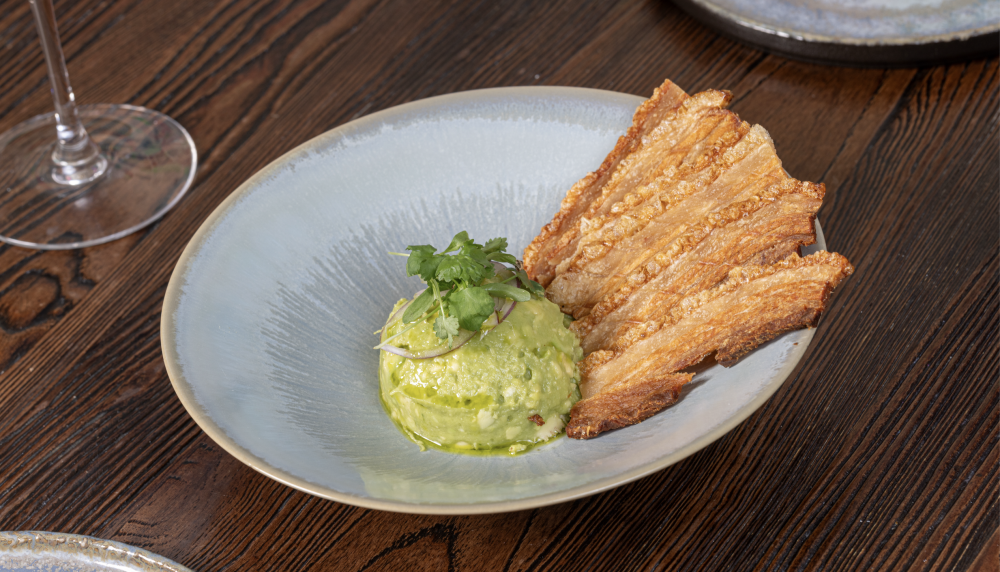The crispiest chicharrón in Miami with our famous Guacamole Chabella.