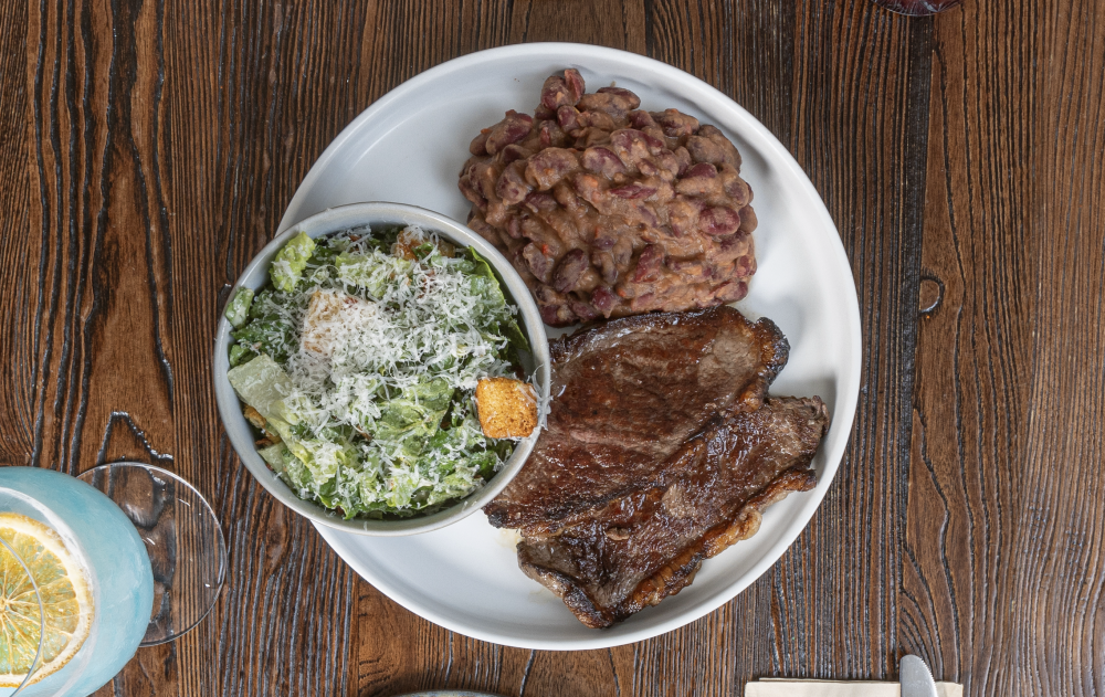 Wood-fired picanha with your choice of two sides.
