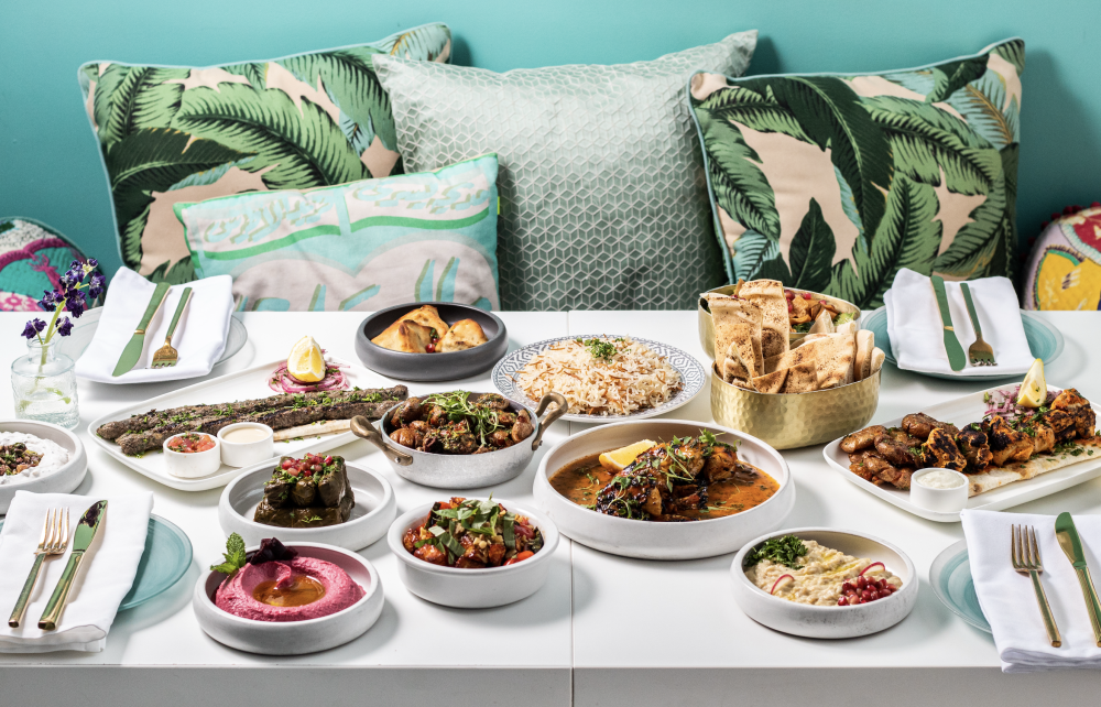 A colorful Lebanese feast at Lira Beirut Eatery - from fresh mezze and warm pita to grilled skewers served in a vibrant and cozy setting