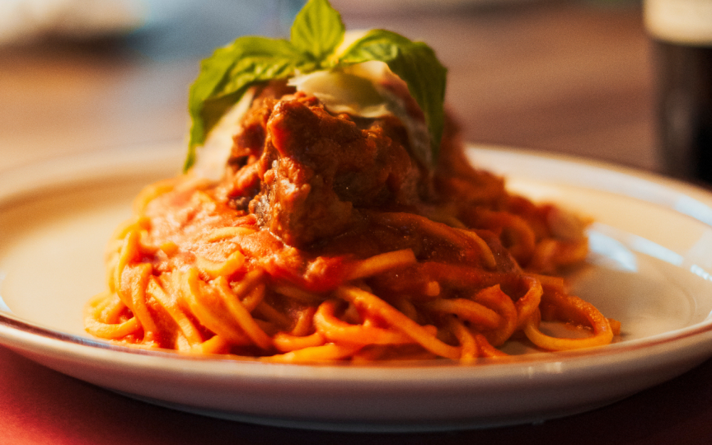 A comforting classic: spaghetti tossed in a rich, slow-cooked homemade Bolognese sauce, made with love and tradition.