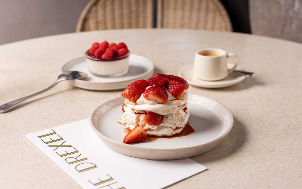 Two ways to end on a high note—will you choose the airy Pavlova or the rich Chocolate Soufflé at The Drexel? Your sweet moment awaits.