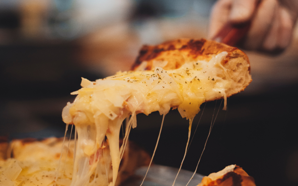 A classic Argentine stuffed fugazzeta, loaded with ham and melted cheese, topped with sweet onions and baked until perfectly golden.