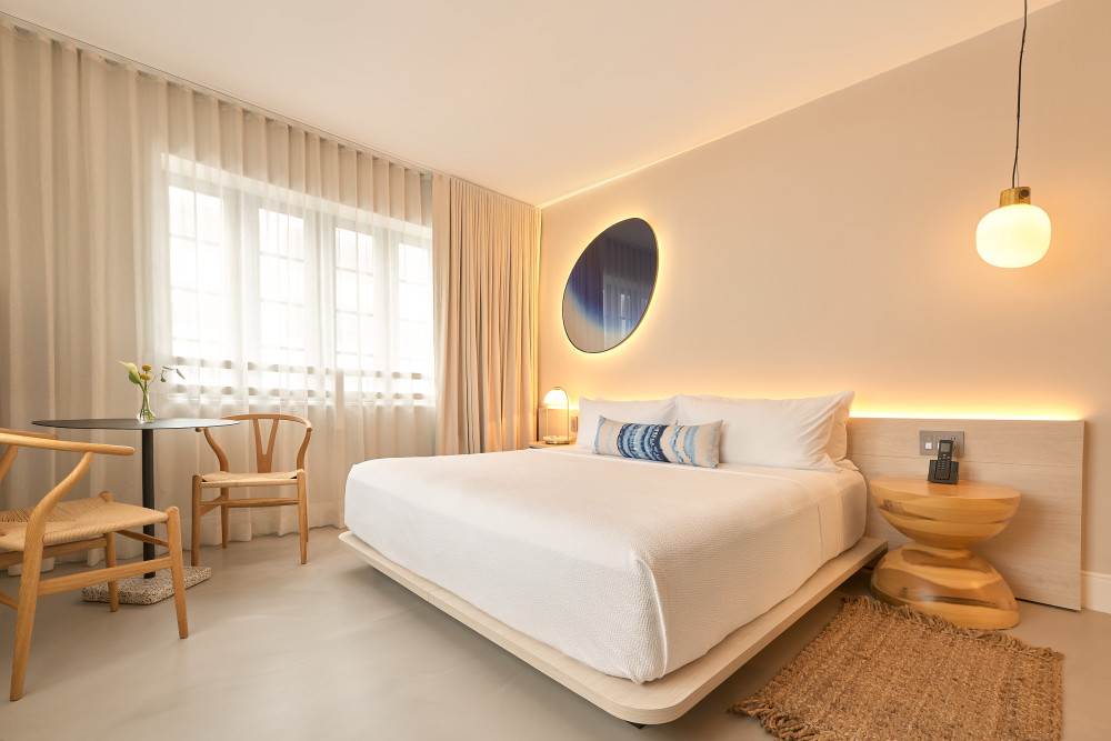 Superior King accommodations with 325 sq. ft. including a king bed, a table and chair and beautiful modern decor.
