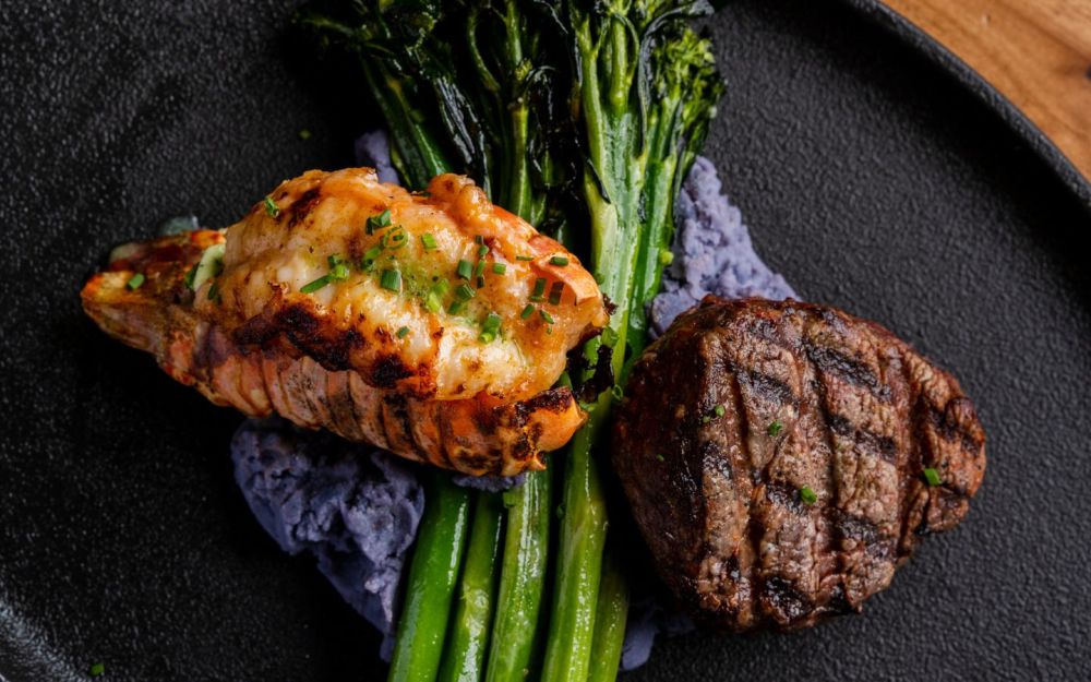 Filet Mignon 8oz and Butter Poached Lobster, Goat Cheese Peruvian Potatoes, Grilled Broccolini