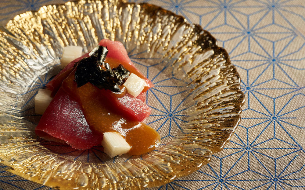 A signature opening to the omakase experience, this beautifully plated Otsukuri dish reflects the elegance and precision that define The Den.