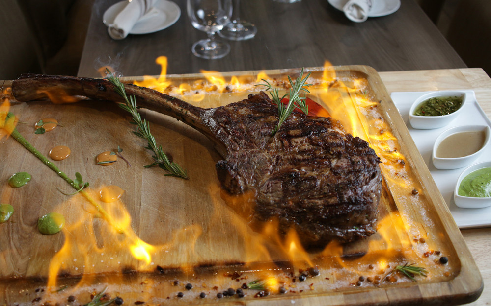Tomahawk, Bone-in Rib Eye, Served with 3 Sides of your Choice