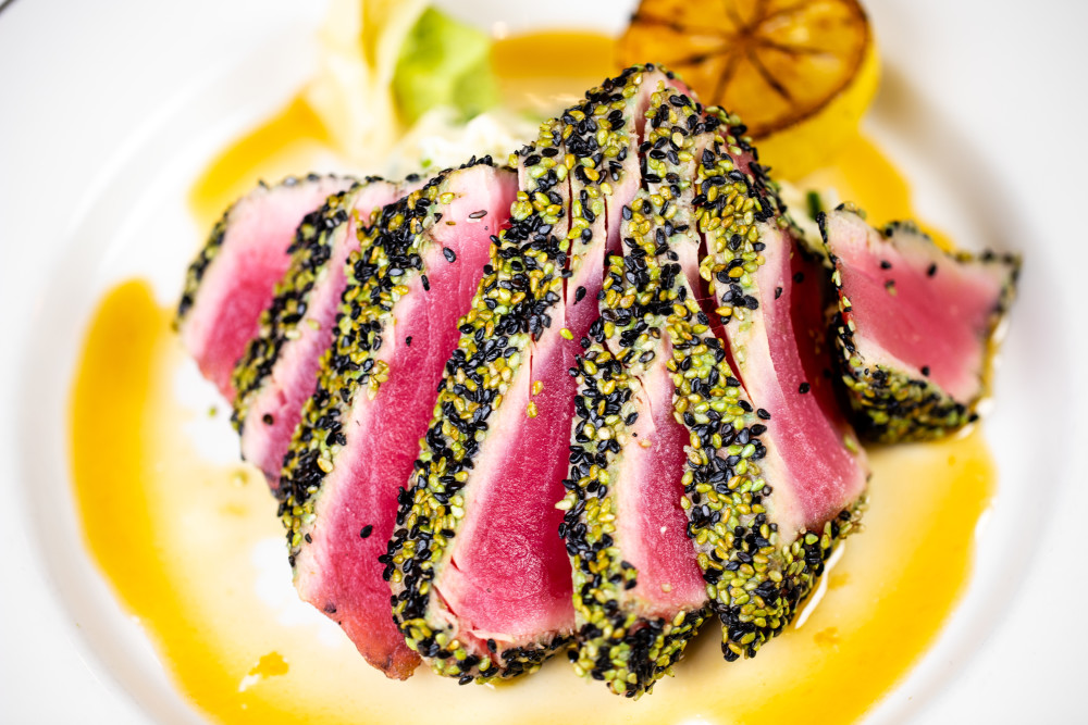 Sesame crusted ahi tuna with tamari wine sauce.