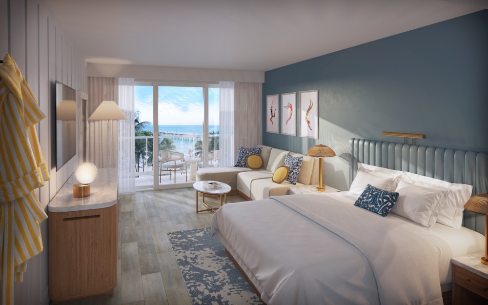 Relax in a stylish Junior Suite featuring a private balcony and ocean views—perfect for enjoying the breeze and unwinding in comfort.