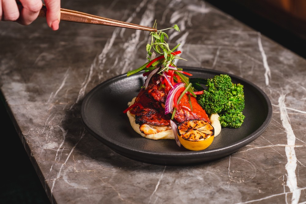 A longtime favorite — tender roasted chicken served over velvety potato foam, crisp green beans, and finished with a bold, tangy Criolla sauce. (Dairy