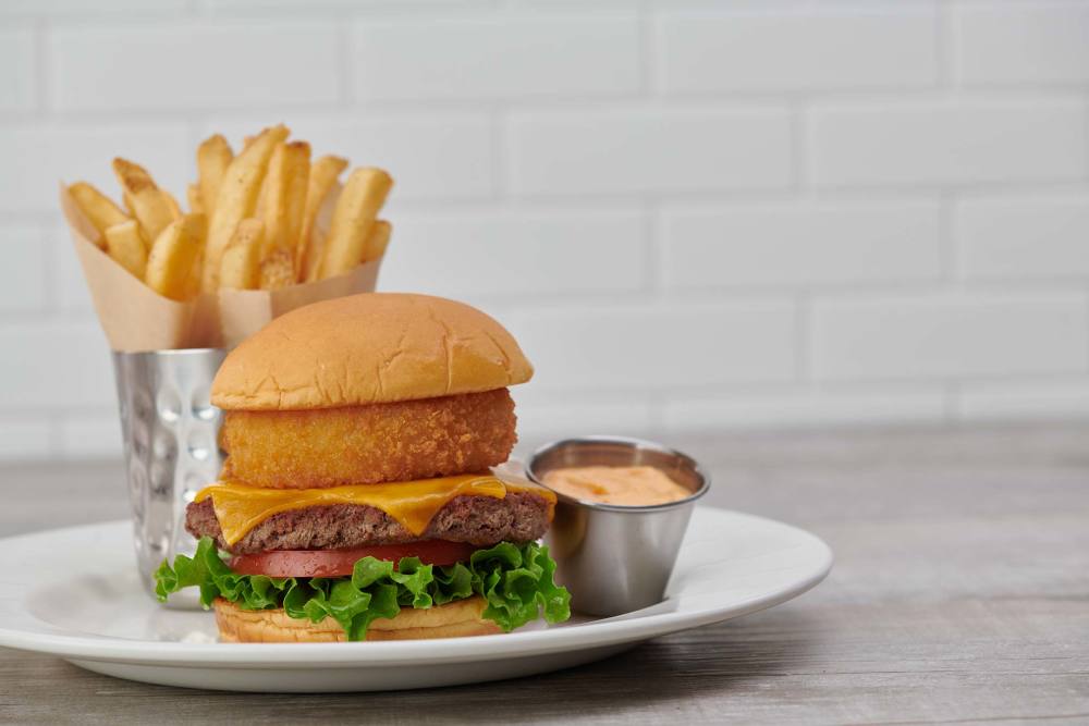 100% plant-based vegan patty, topped with Tillamook® cheddar cheese and a crispy onion ring, served with leaf lettuce and vine-ripened tomato.