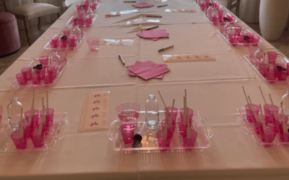 Pink-themed fragrance workshop setup, ready for creative blending